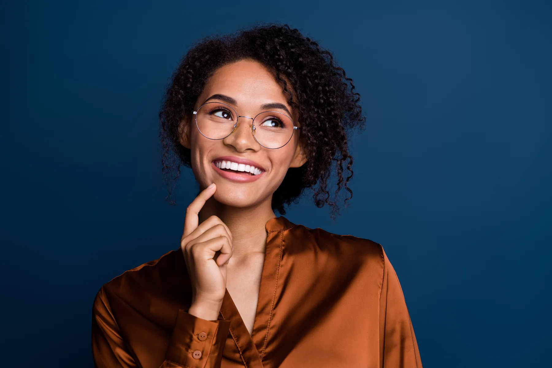 Smiling Woman on Blue Background Smiling woman against a blue background