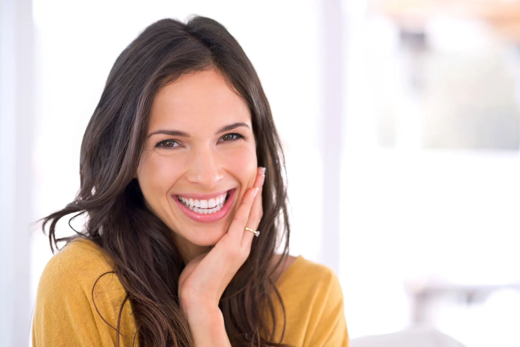Smiling Woman in Bright Room Smiling woman in a bright room
